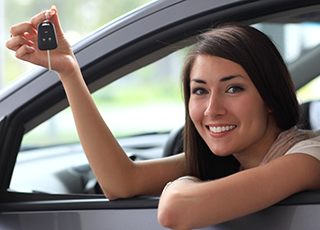 Woman Looking Out of Car Window Holding Car Keys with Car Insurance in Phoenixville, Skippack, Limerick, Royersford, Collegeville