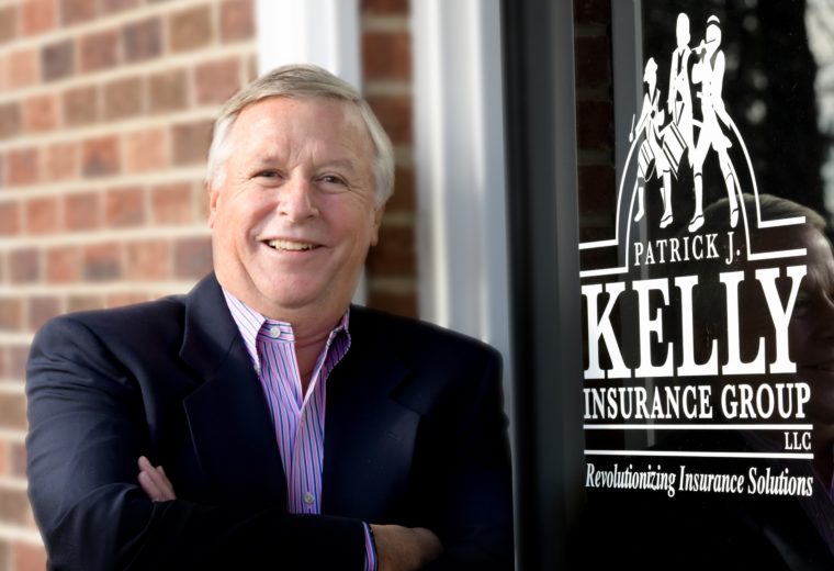 Man in Front of Patrick J Kelly Insurance Group Sign on Door with Insurance in Royersford, Limerick, Phoenixville, Skippack, Collegeville, and Trappe